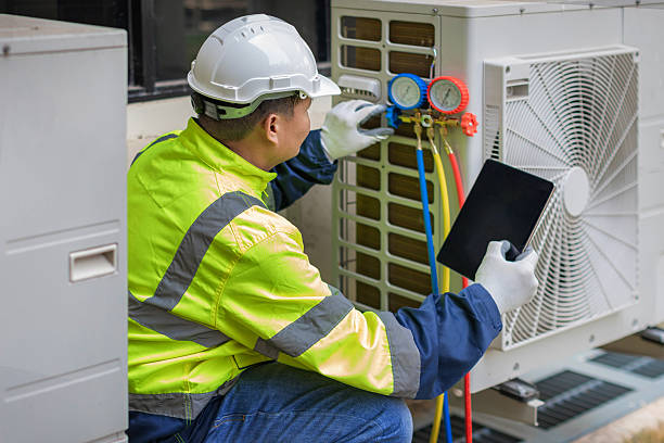 Professional Air Conditioning Repair technician working in Lambertville, MI